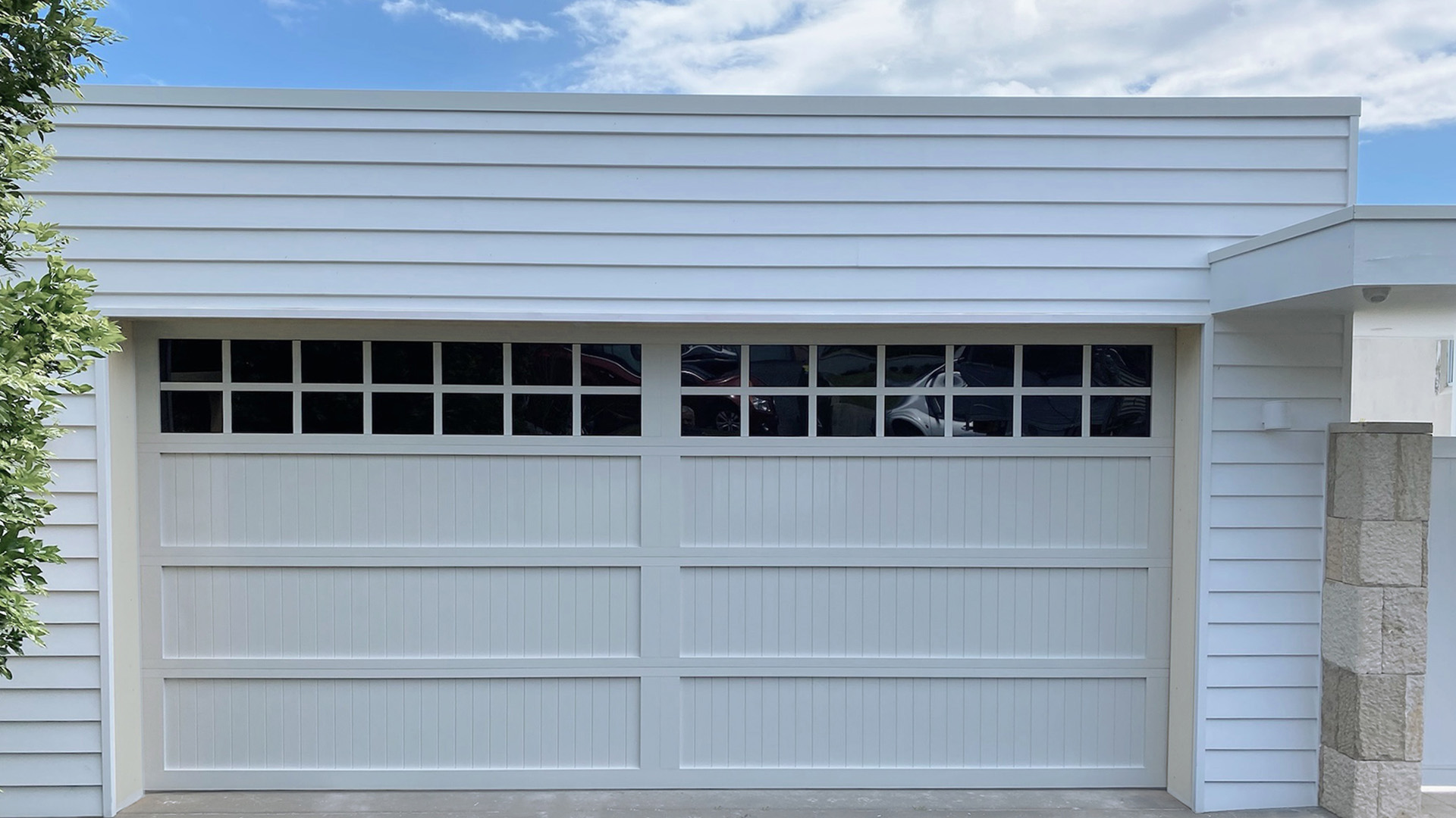 luxury designer garage door Hamptons style with windows